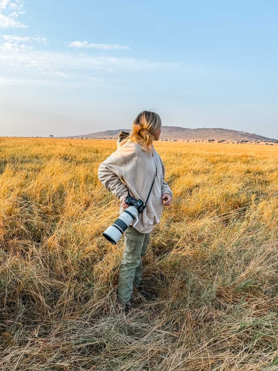Standing in the long grass in the middle of the Serengeti.